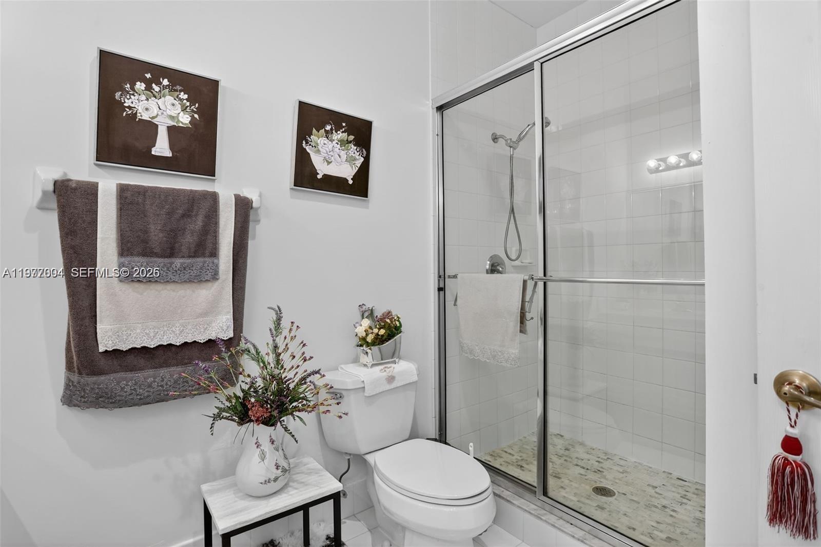 728 Southeast 2nd Street Pompano Beach, FL 33060 - Photo 17 of 22 a bathroom with a toilet sink and shower