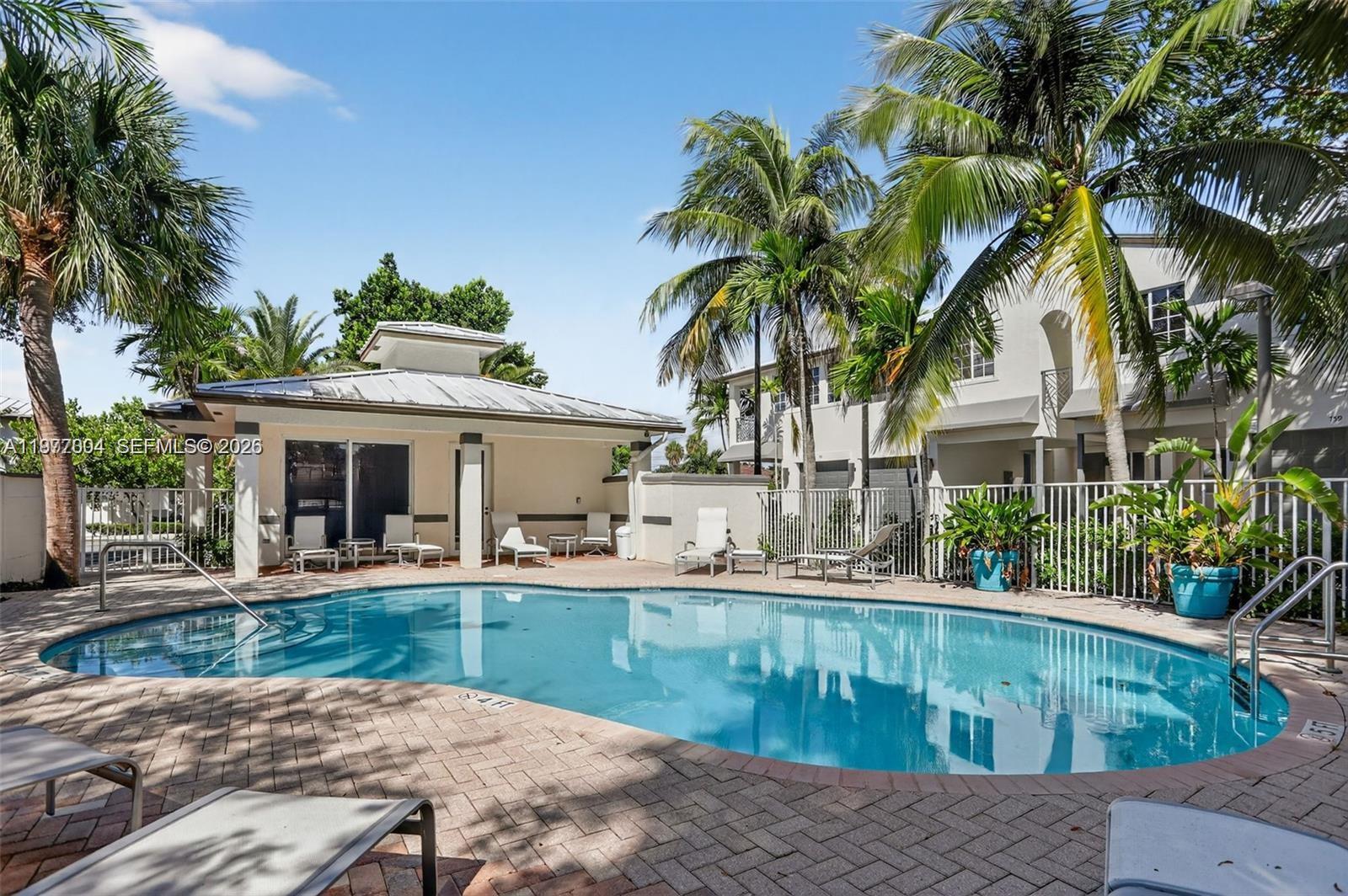 728 Southeast 2nd Street Pompano Beach, FL 33060 - Photo 22 of 22 a view of a house with pool and sitting area