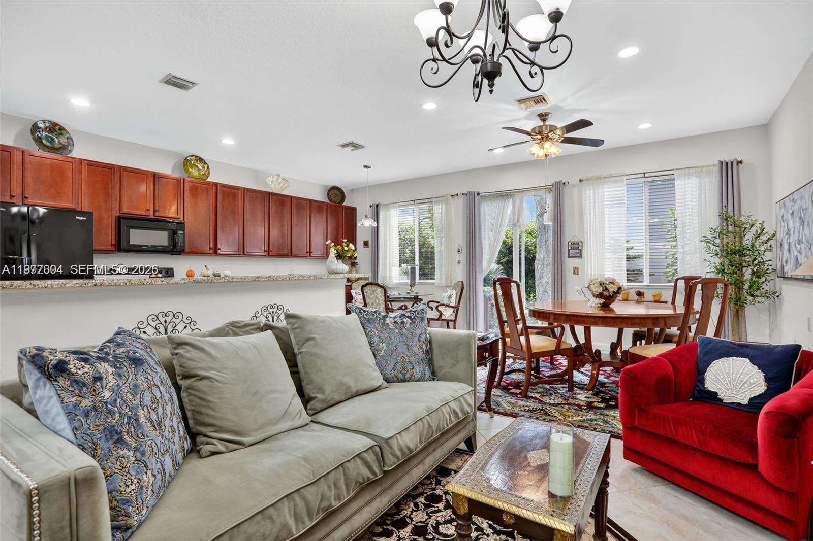 728 Southeast 2nd Street Pompano Beach, FL 33060 - Photo 3 of 22 a living room with furniture kitchen view and a dining table