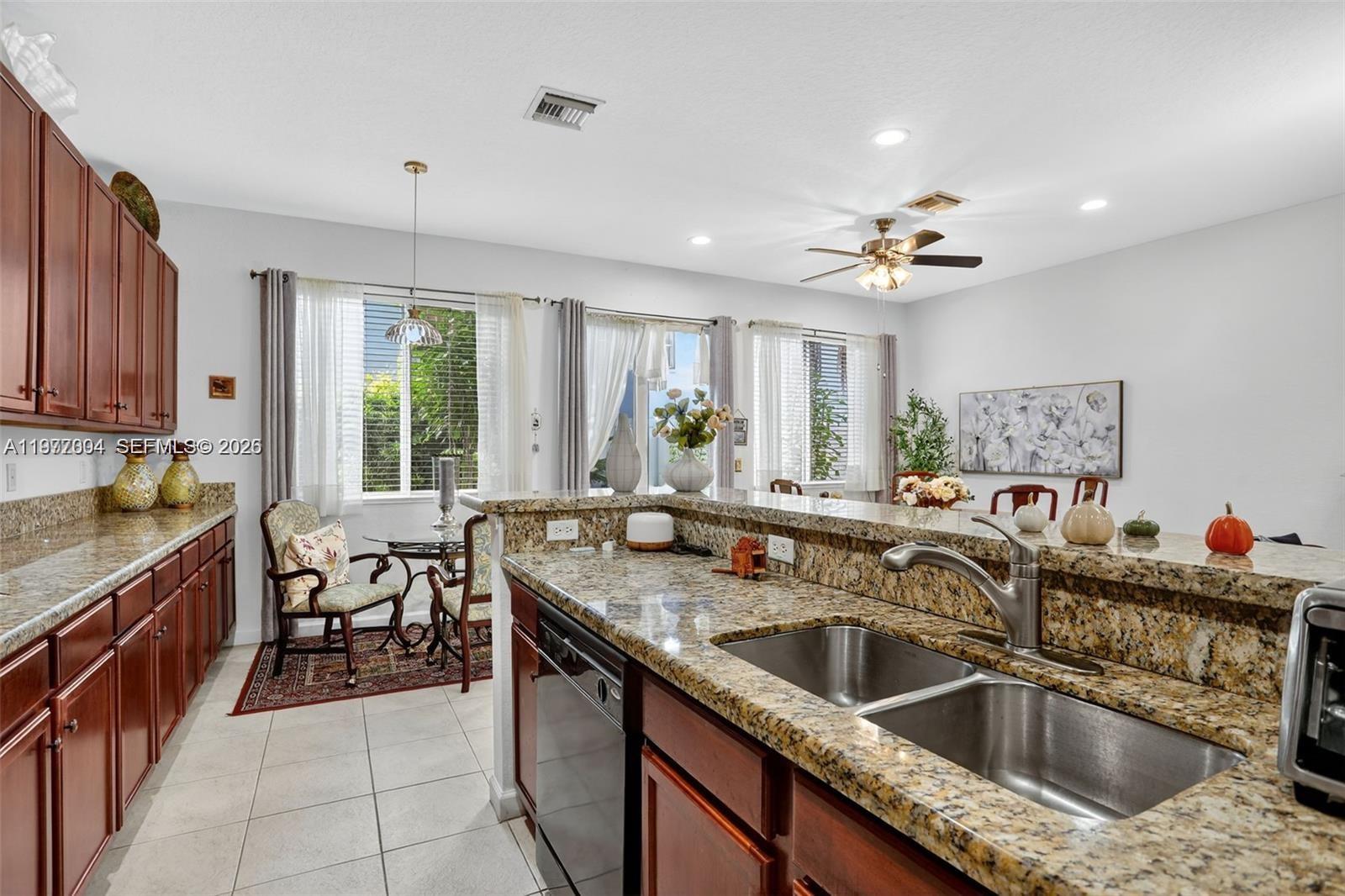 728 Southeast 2nd Street Pompano Beach, FL 33060 - Photo 7 of 22 a kitchen with a sink stove and cabinets