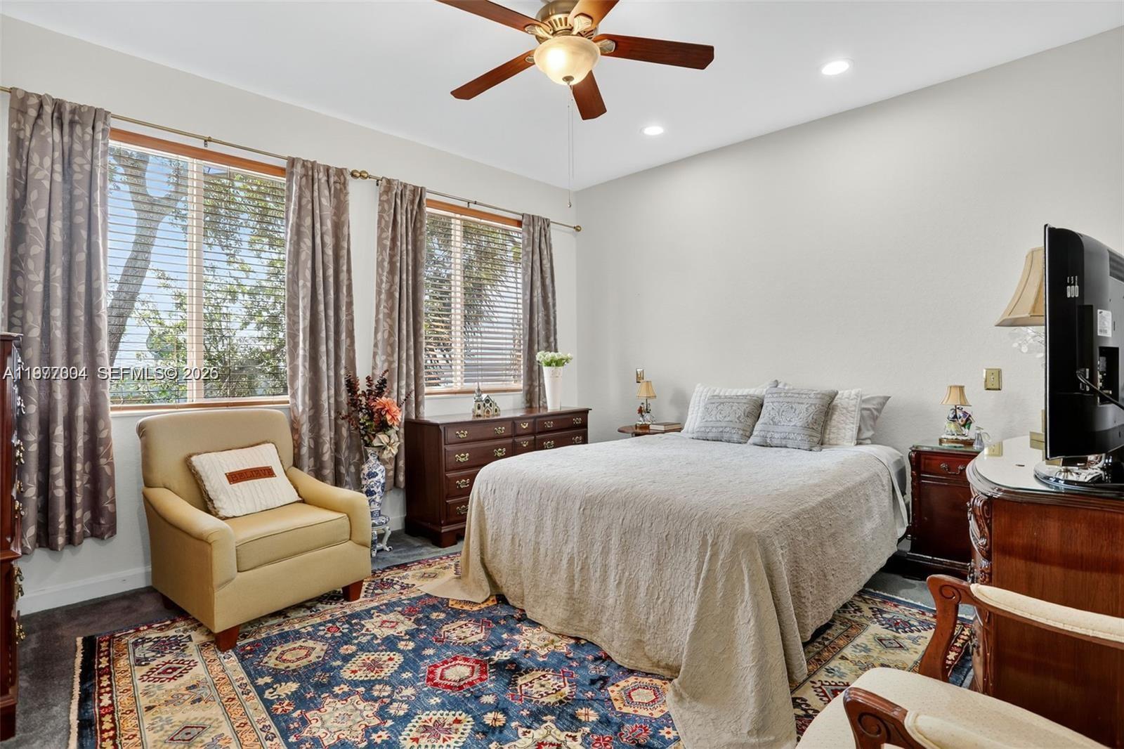 728 Southeast 2nd Street Pompano Beach, FL 33060 - Photo 10 of 22 a bedroom with a bed and a couch