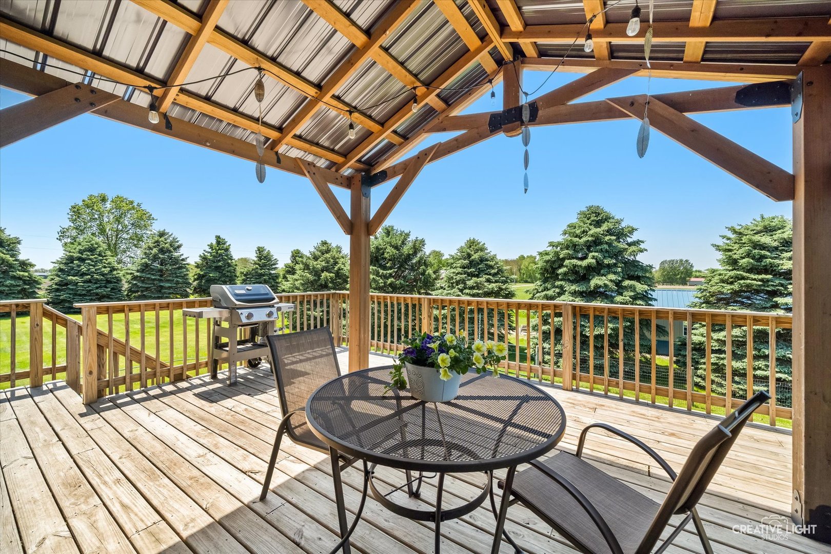 13495 Fennel Road Newark, IL 60541 - Photo 30 of 43 a view of a balcony with wooden floor and outdoor seating