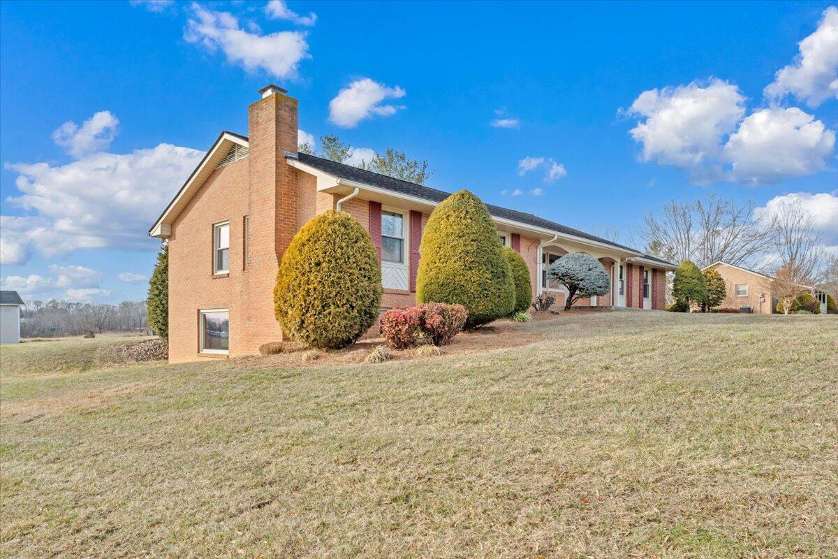 5985 Collier Street Dublin, VA 24084 - Photo 12 of 53 a view of a house with a yard