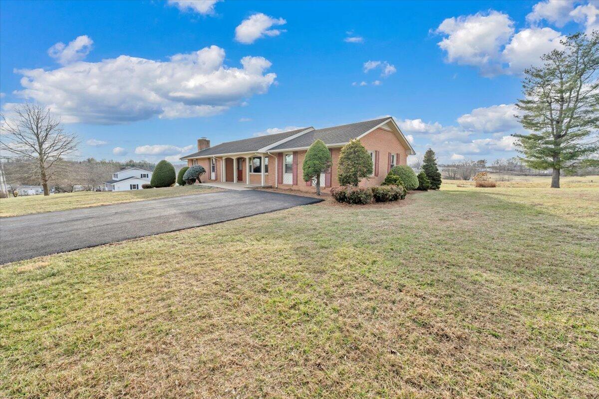 5985 Collier Street Dublin, VA 24084 - Photo 17 of 53 a view of a house with a yard