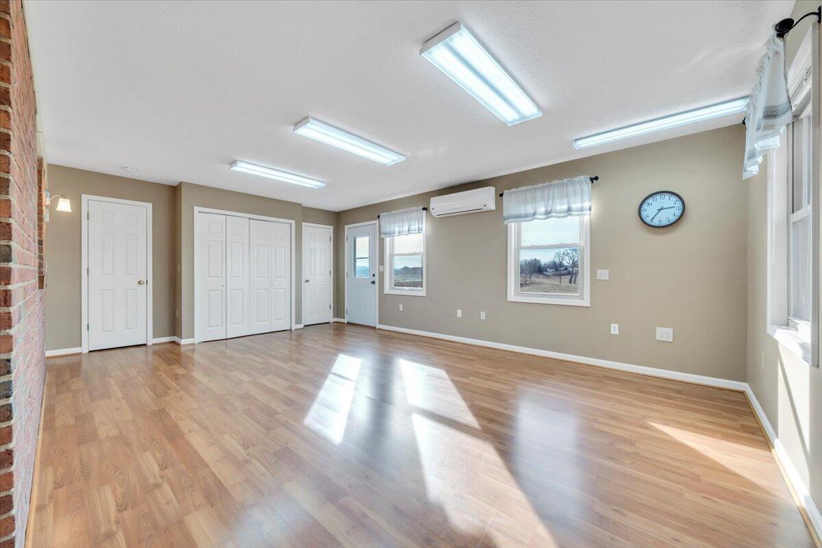 5985 Collier Street Dublin, VA 24084 - Photo 33 of 53 a view of an empty room with window and wooden floor
