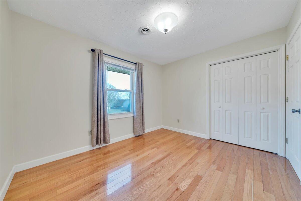5985 Collier Street Dublin, VA 24084 - Photo 42 of 53 wooden floor in an empty room with a window