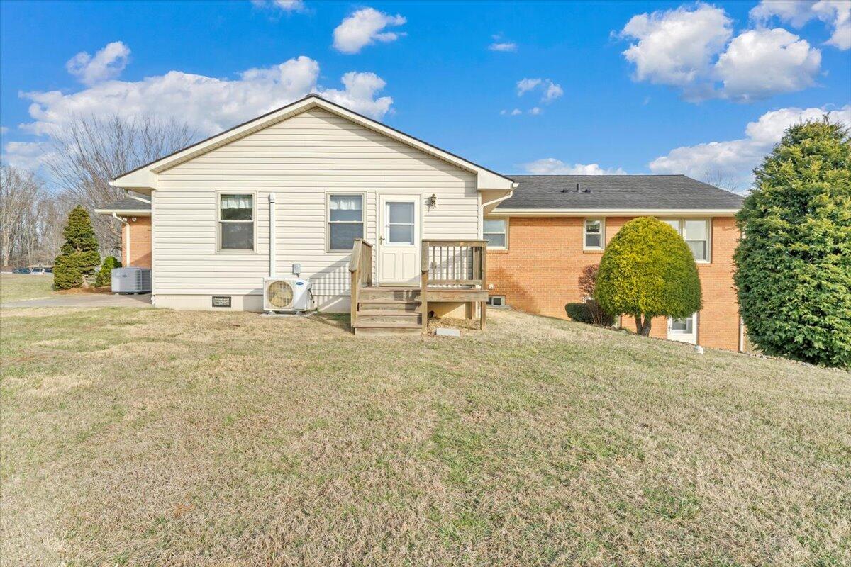 5985 Collier Street Dublin, VA 24084 - Photo 5 of 53 a view of a backyard with sitting area