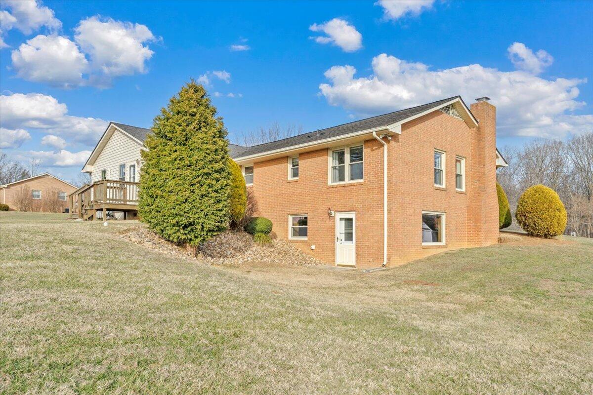 5985 Collier Street Dublin, VA 24084 - Photo 8 of 53 a view of a house with a backyard