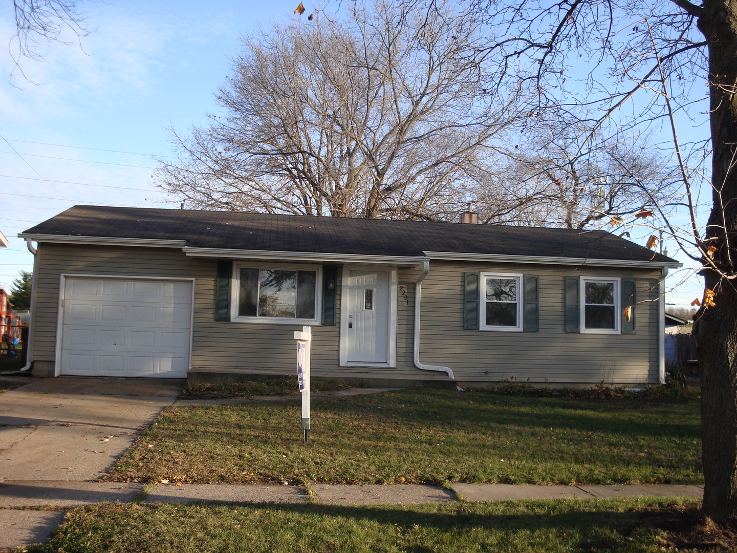 2201 Winters Drive Loves Park, IL 61111 - Photo 1 of 21 a front view of a house with garden