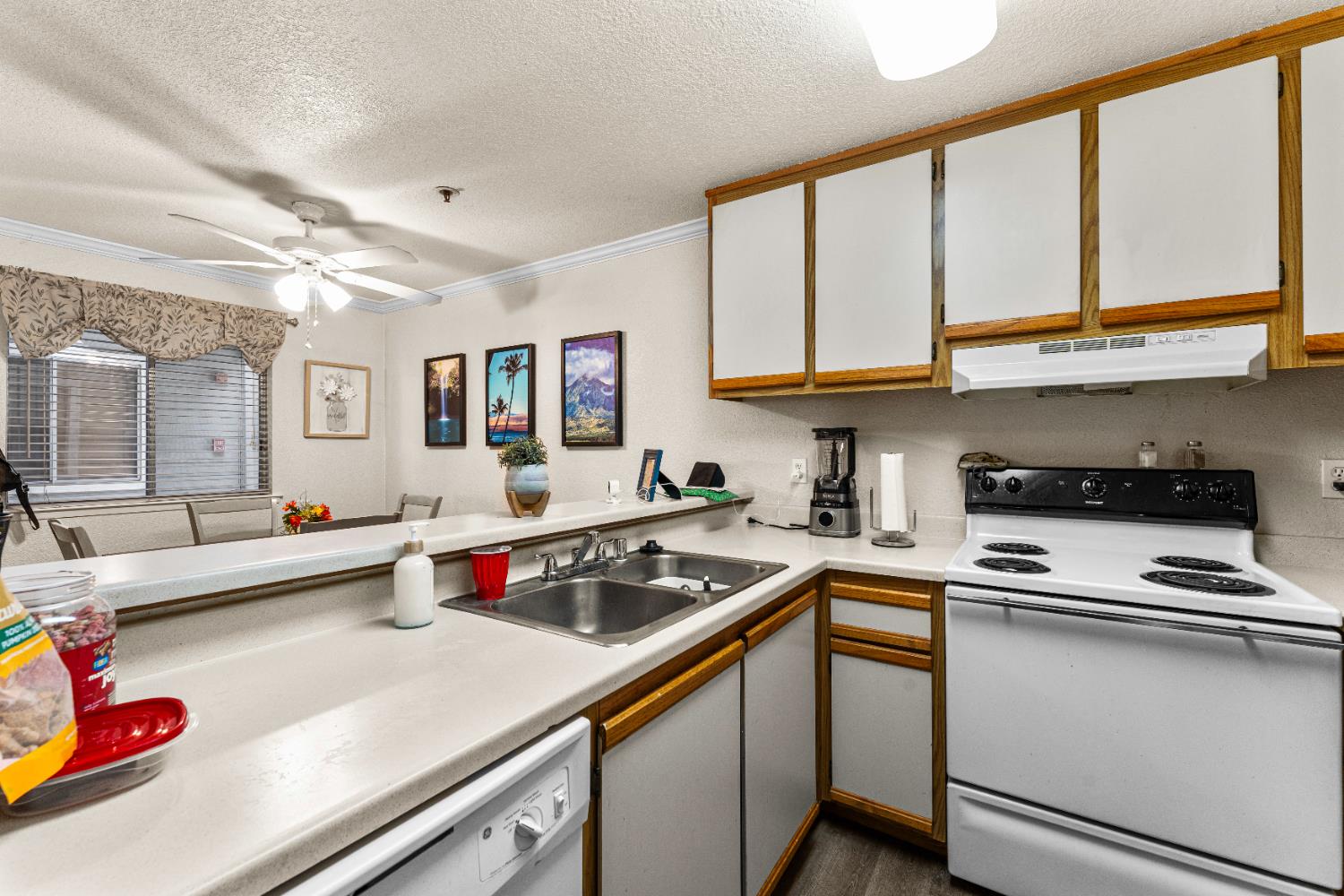1019 Dornajo Way, Unit 123 Sacramento, CA 95825 - Photo 12 of 23 a kitchen with stainless steel appliances granite countertop a stove and a sink