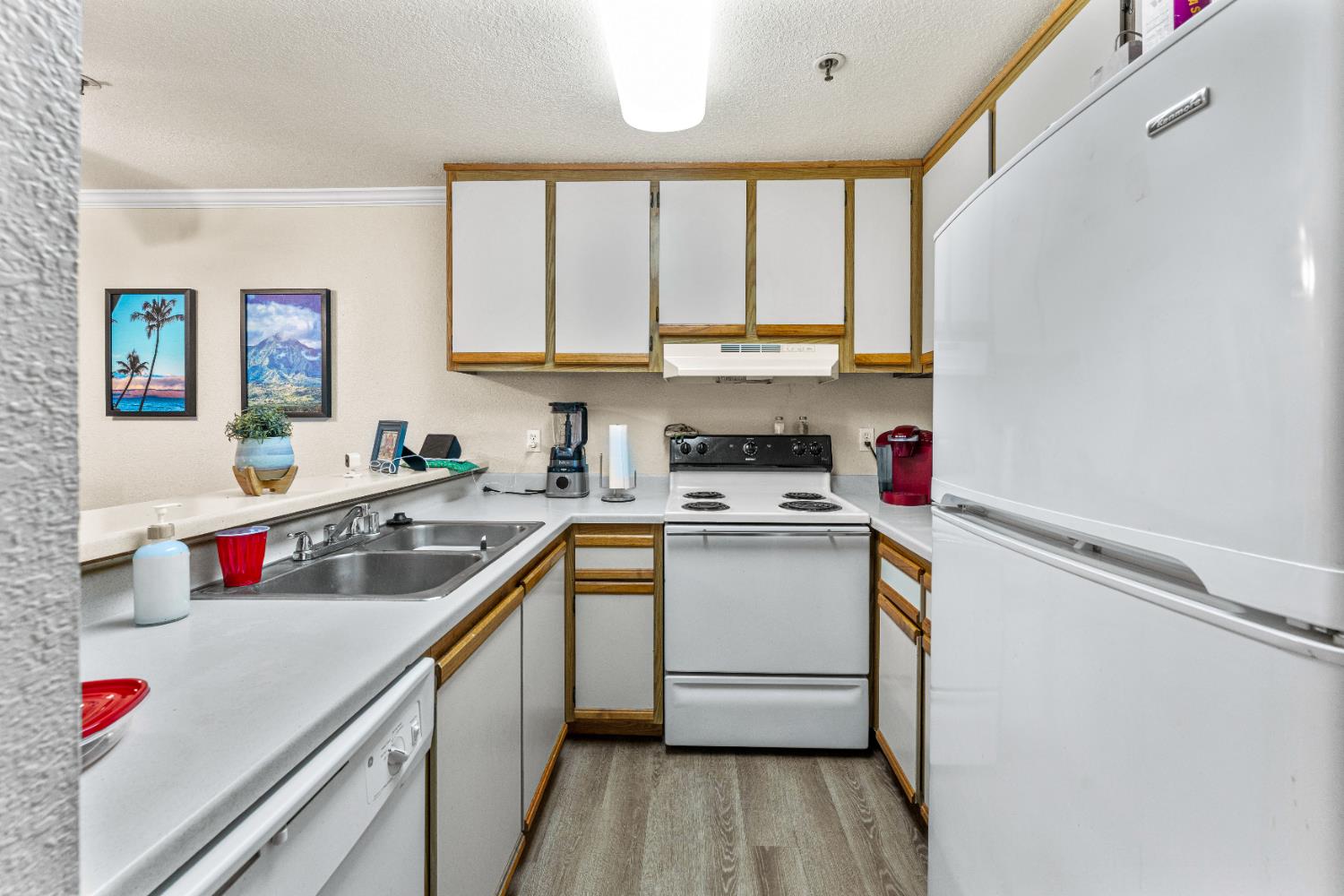1019 Dornajo Way, Unit 123 Sacramento, CA 95825 - Photo 13 of 23 a kitchen with a sink cabinets and window
