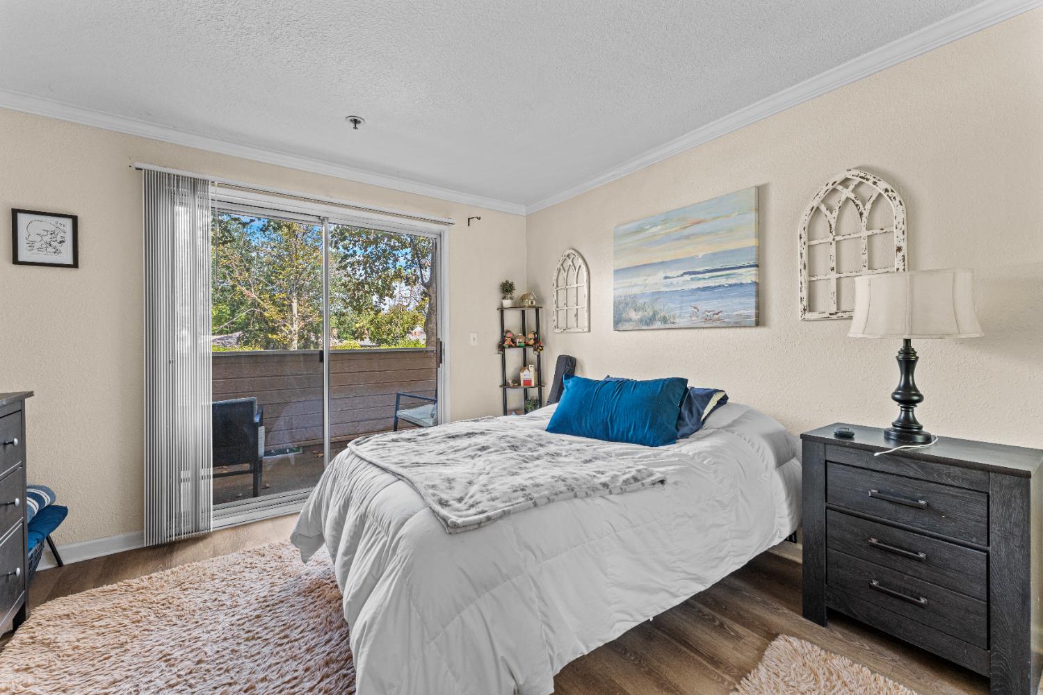 1019 Dornajo Way, Unit 123 Sacramento, CA 95825 - Photo 17 of 23 a bedroom with a bed and a window