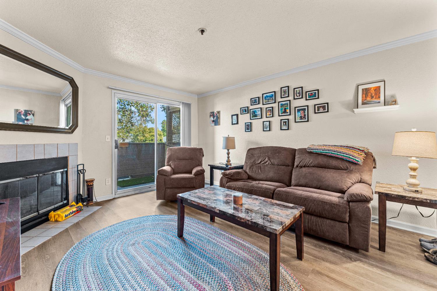 1019 Dornajo Way, Unit 123 Sacramento, CA 95825 - Photo 9 of 23 a living room with furniture and a fireplace