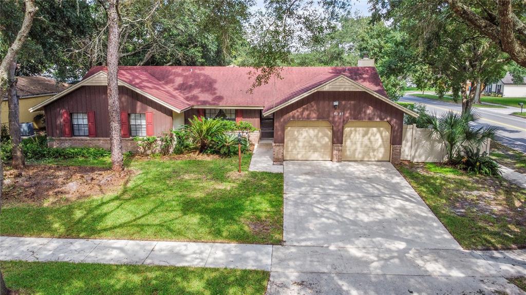 5237 Signal Hill Road Orlando, FL 32808 - Photo 1 of 1 a front view of a house with a yard