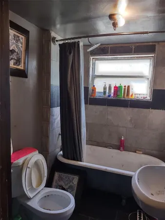 a bathroom with a toilet and a sink
