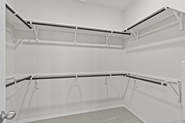 wooden floor in a hall with a window