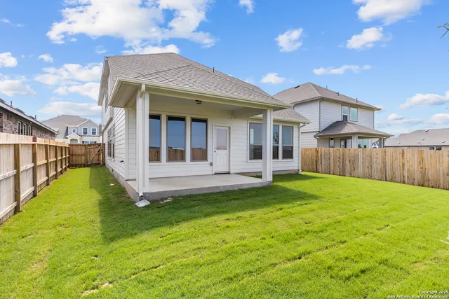 a view of a house with swimming pool in front of it