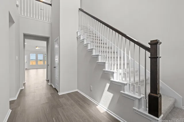 a view of entryway with wooden floor