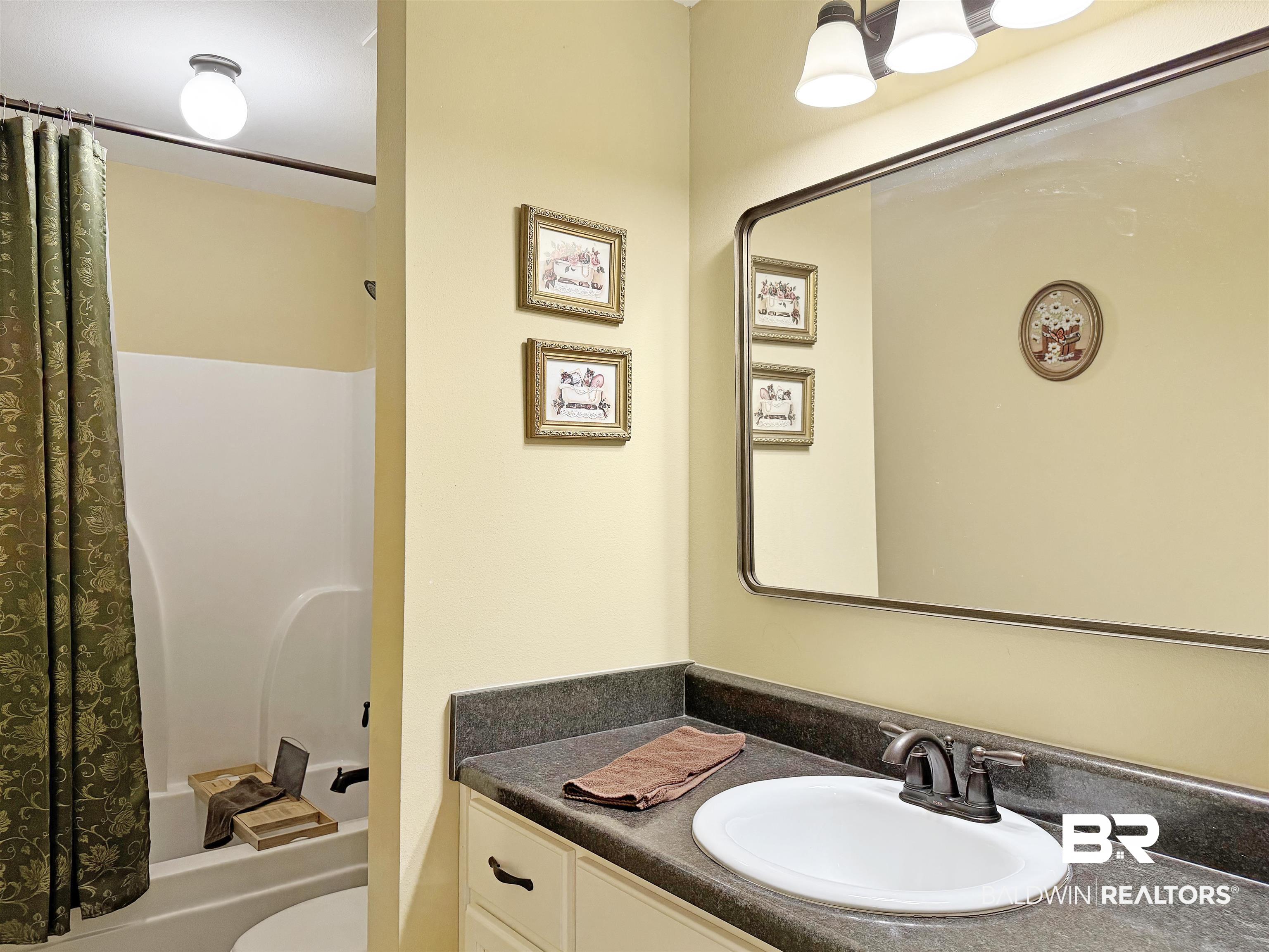 30687 Brady Road Robertsdale, AL 36567 - Photo 28 of 53 Full bathroom with vanity, toilet, shower / bathtub combo.