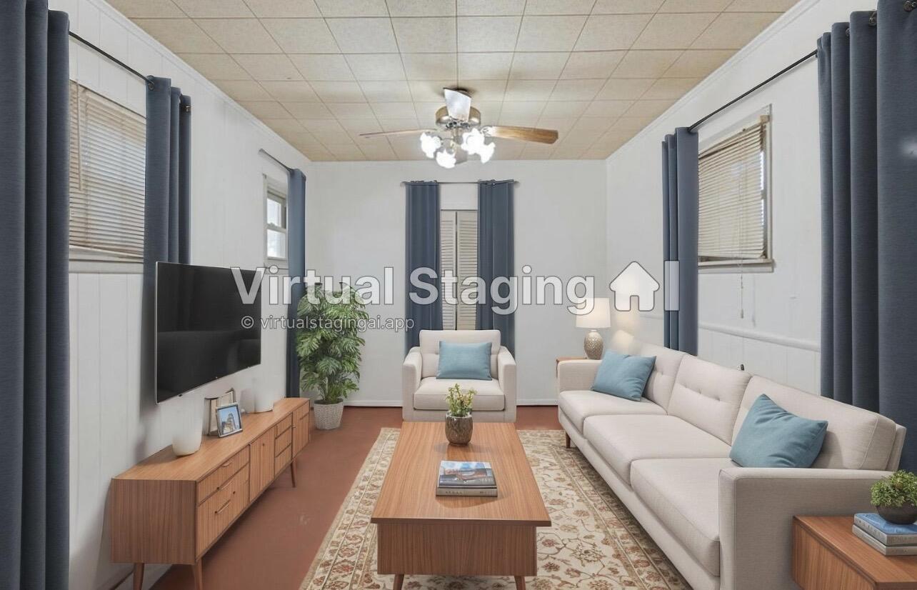 705 6th Street Wolfforth, TX 79382 - Photo 14 of 29 a living room with furniture and a flat screen tv