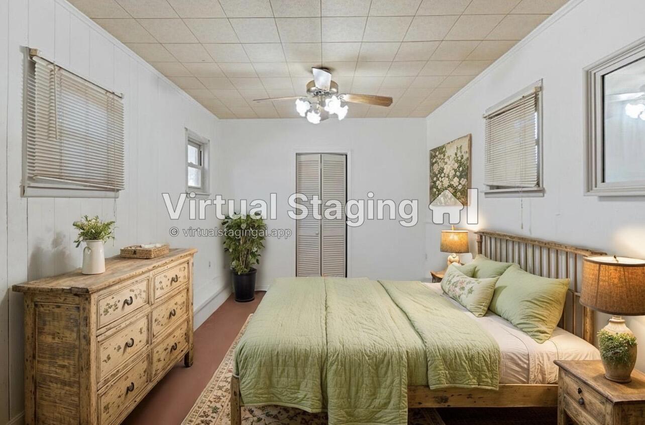 705 6th Street Wolfforth, TX 79382 - Photo 15 of 29 a bedroom with a large bed and a chandelier