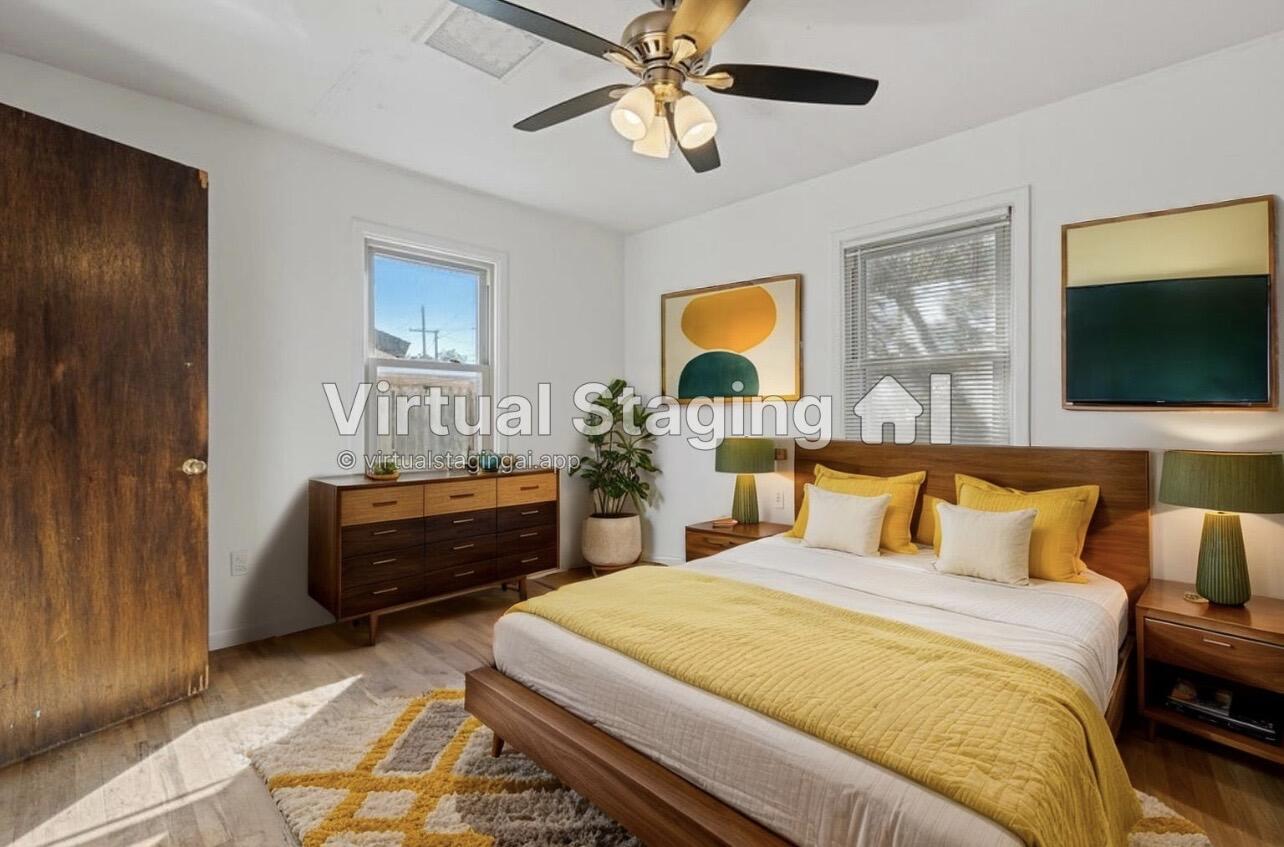 705 6th Street Wolfforth, TX 79382 - Photo 17 of 29 a bedroom with a bed and flat screen tv