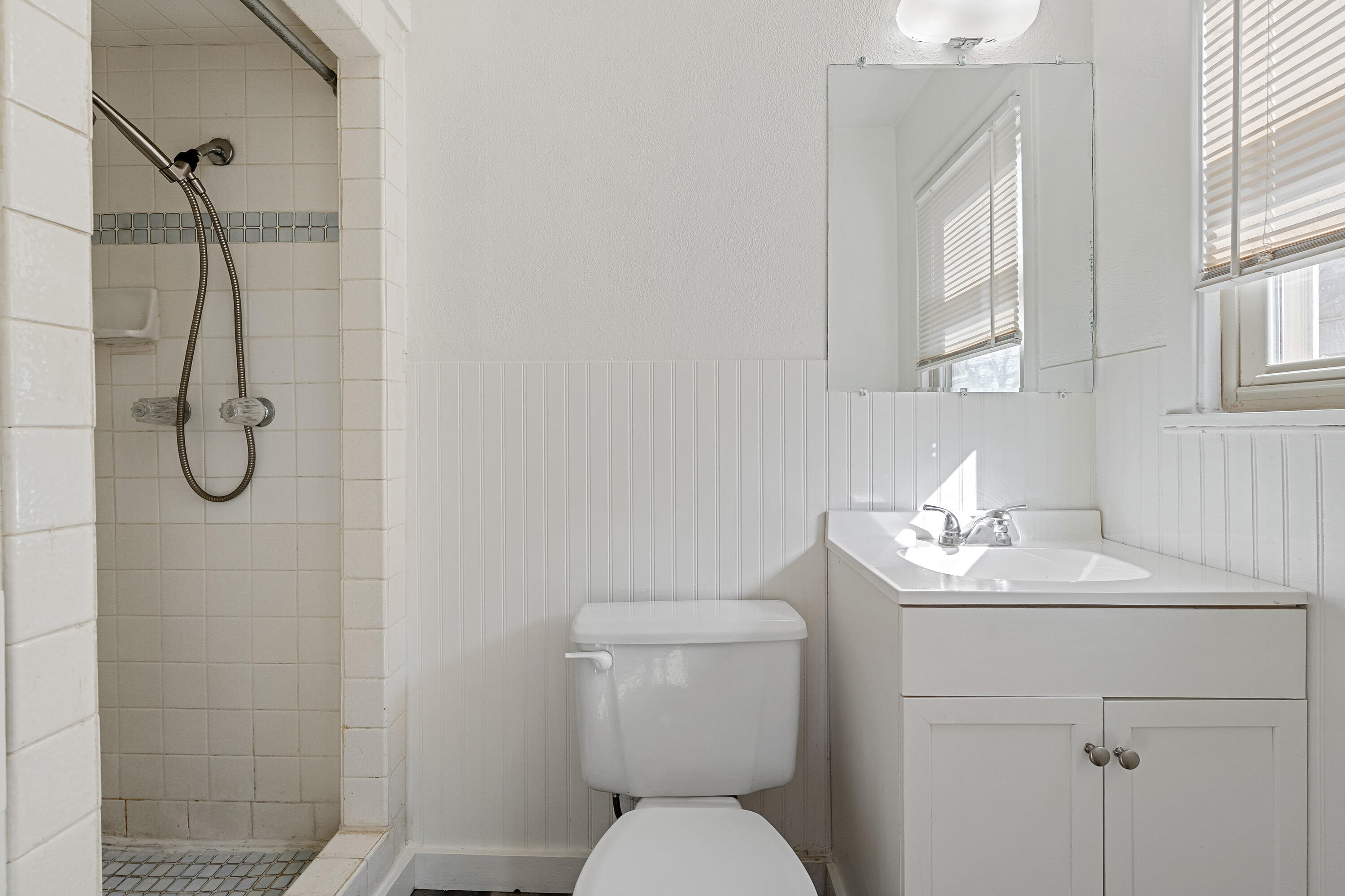 705 6th Street Wolfforth, TX 79382 - Photo 20 of 29 a bathroom with a toilet sink shower and mirror