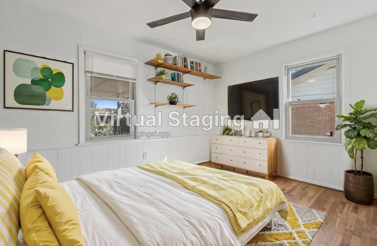 705 6th Street Wolfforth, TX 79382 - Photo 21 of 29 a bedroom with a bed and a flat screen tv
