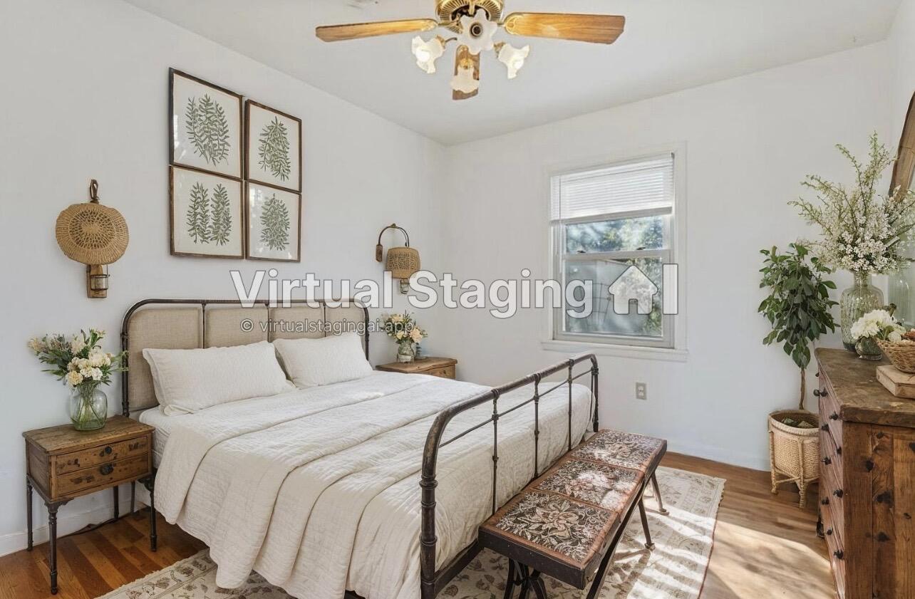 705 6th Street Wolfforth, TX 79382 - Photo 23 of 29 a bedroom with a bed and a chandelier