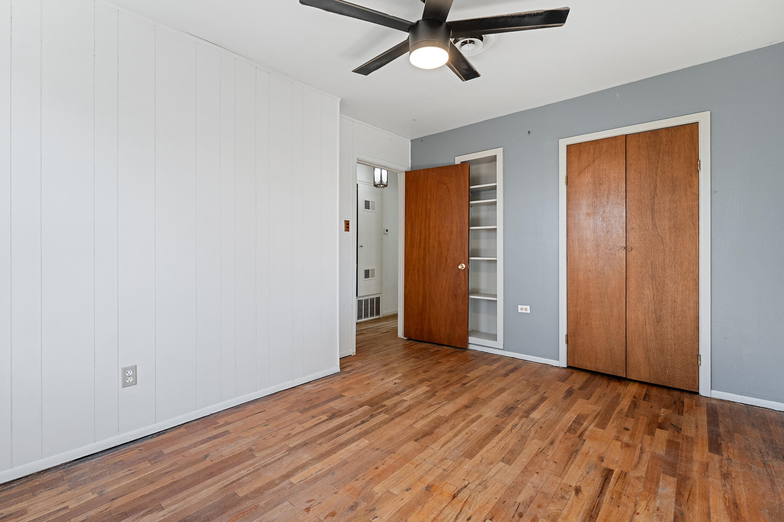 705 6th Street Wolfforth, TX 79382 - Photo 25 of 29 an empty room with wooden floor a ceiling fan