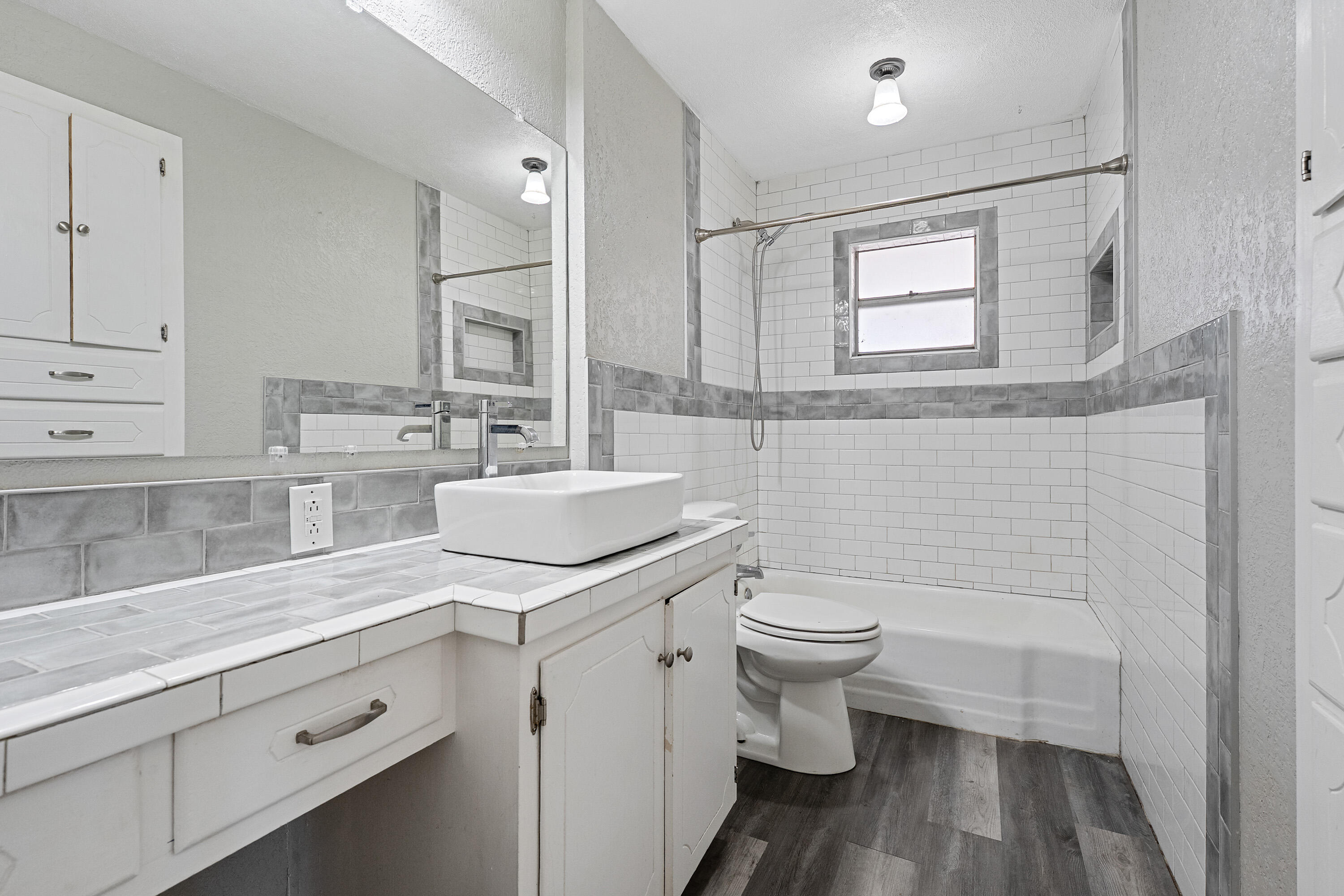 705 6th Street Wolfforth, TX 79382 - Photo 26 of 29 a bathroom with a sink a toilet and shower
