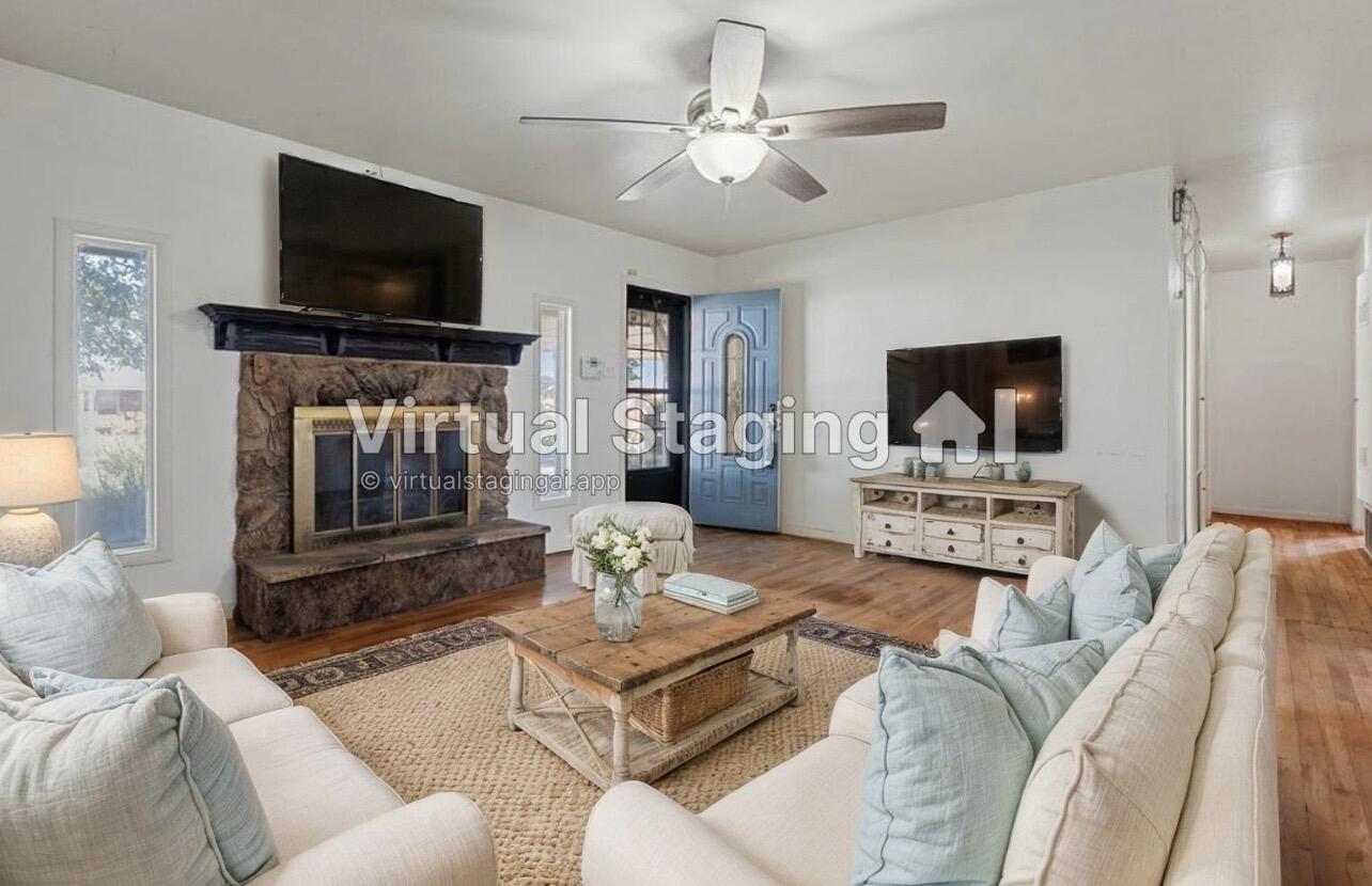 705 6th Street Wolfforth, TX 79382 - Photo 3 of 29 a living room with furniture and a flat screen tv