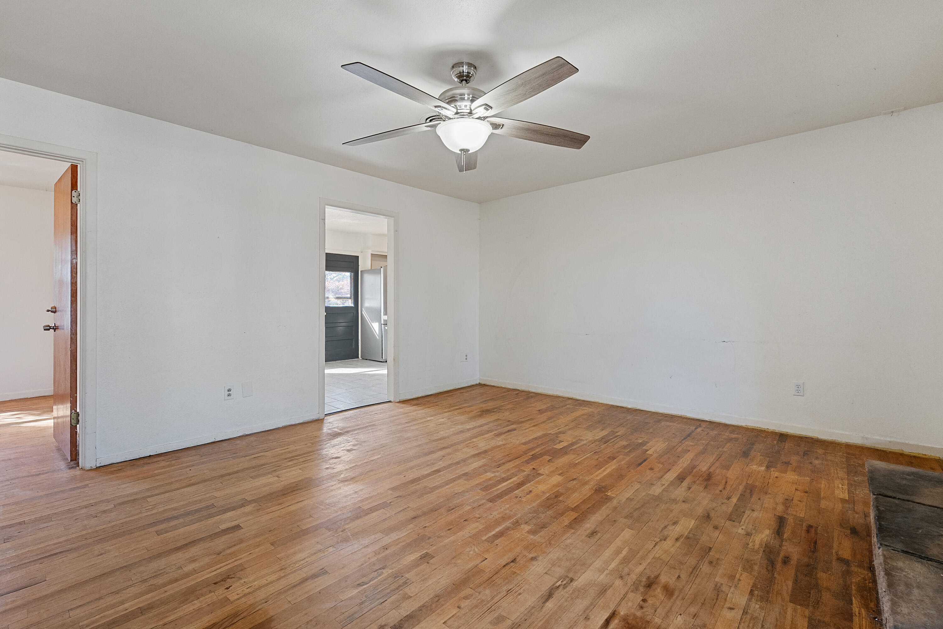 705 6th Street Wolfforth, TX 79382 - Photo 8 of 29 a view of an empty room with wooden floor
