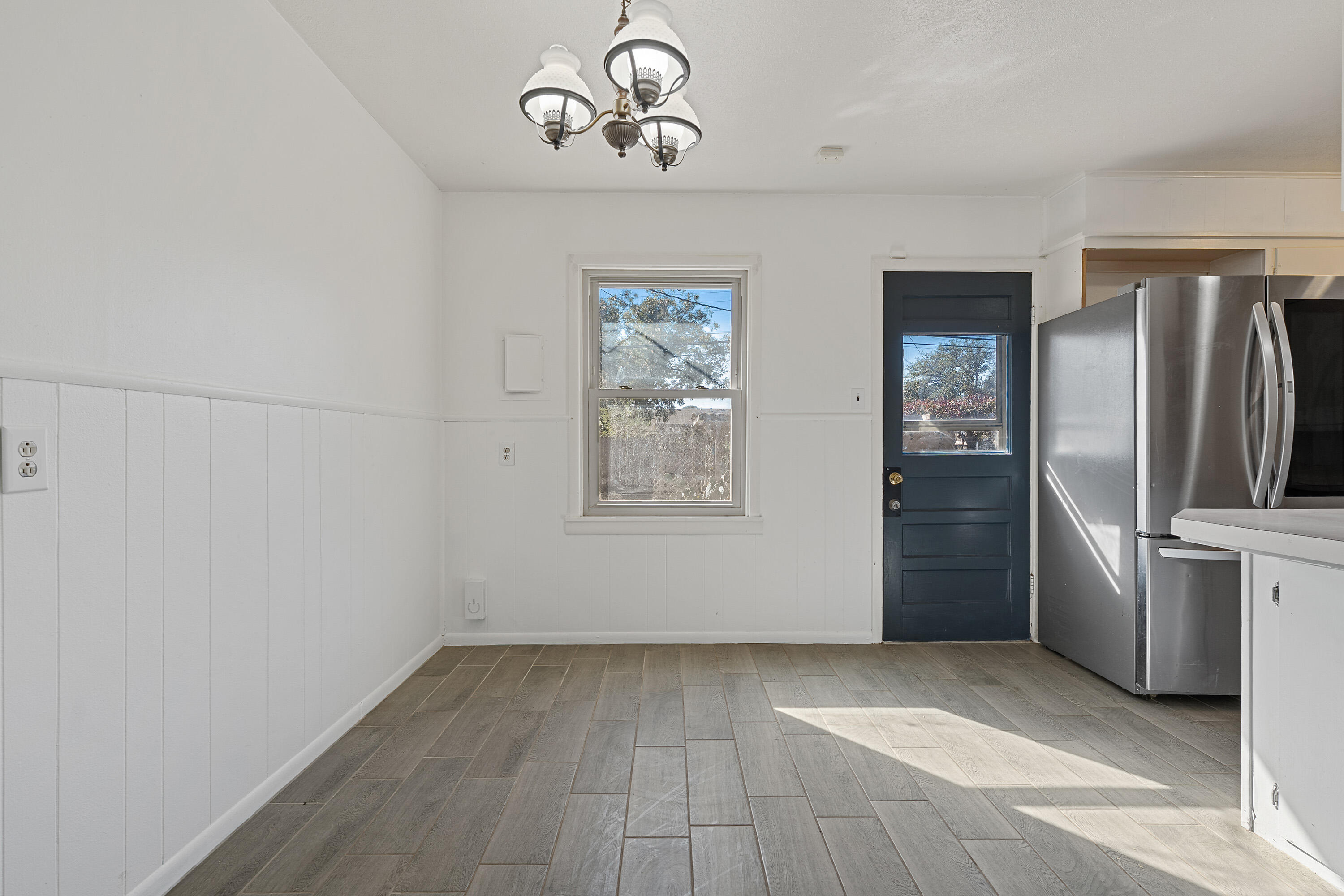 705 6th Street Wolfforth, TX 79382 - Photo 9 of 29 a view of a refrigerator in kitchen and window