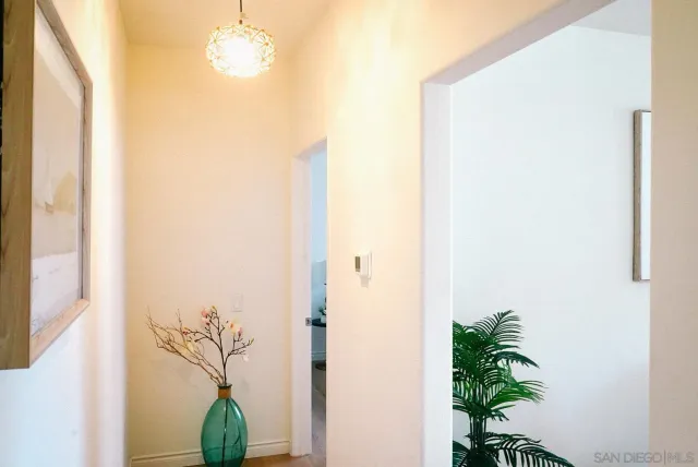 a front view of a house with a garden and yard