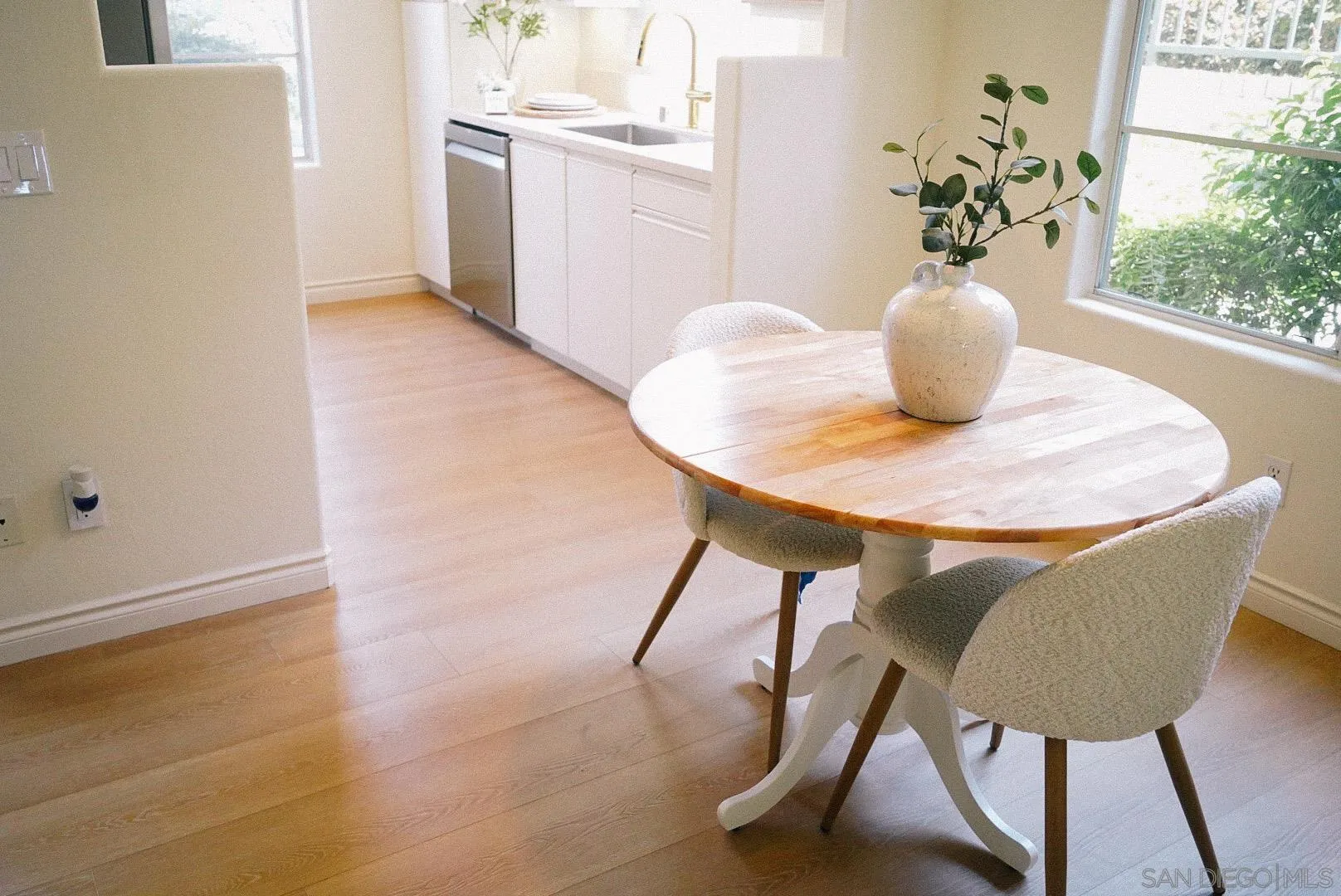 3537 Caminito El Rincon, Unit 259 San Diego, CA 92130 - Photo 19 of 59 a dining room with furniture and wooden floor