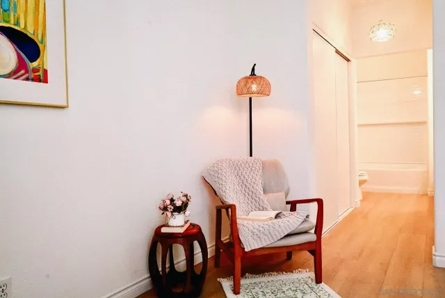 a front view of a house with garden and sitting area