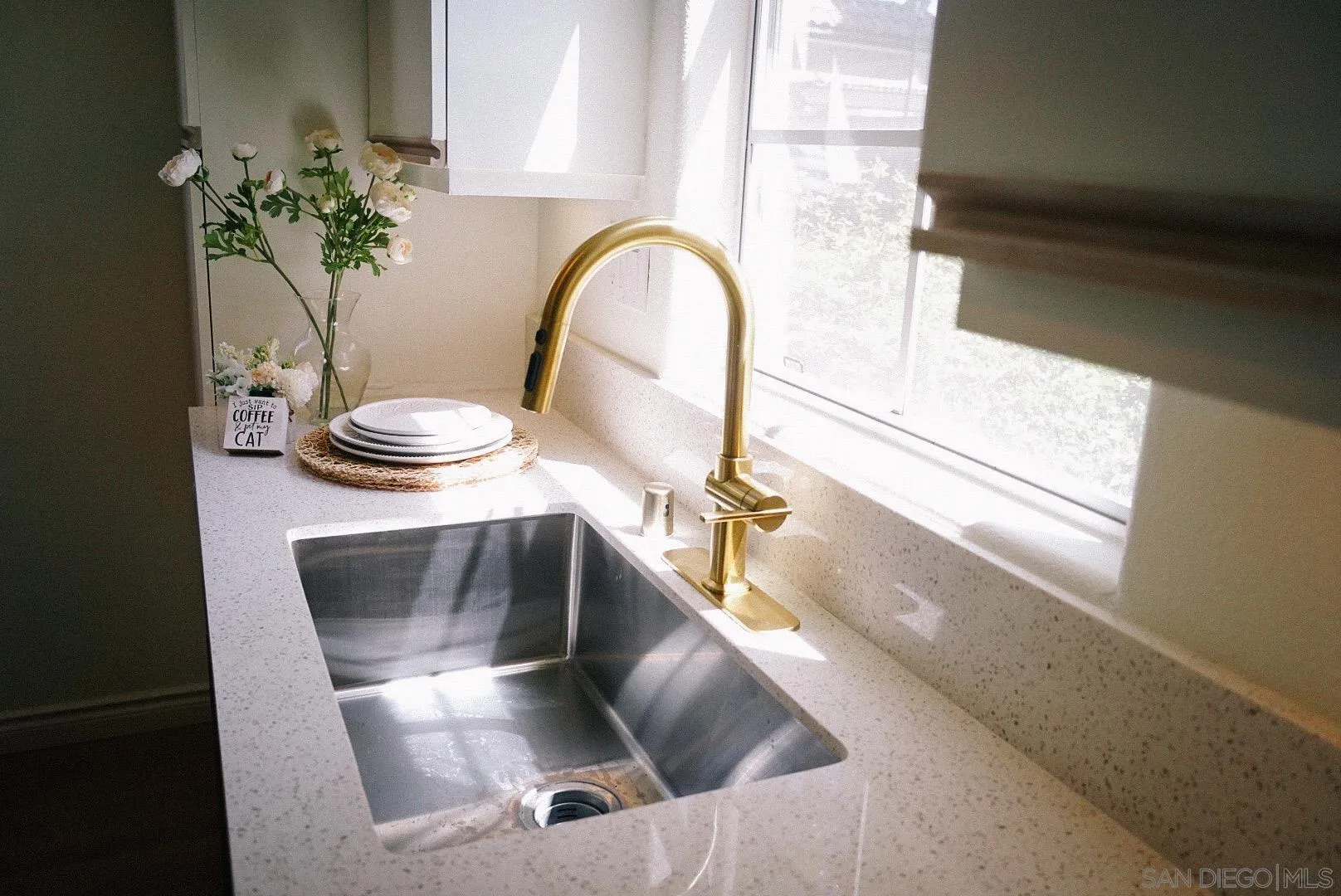 3537 Caminito El Rincon, Unit 259 San Diego, CA 92130 - Photo 42 of 59 a kitchen with a sink and a mirror
