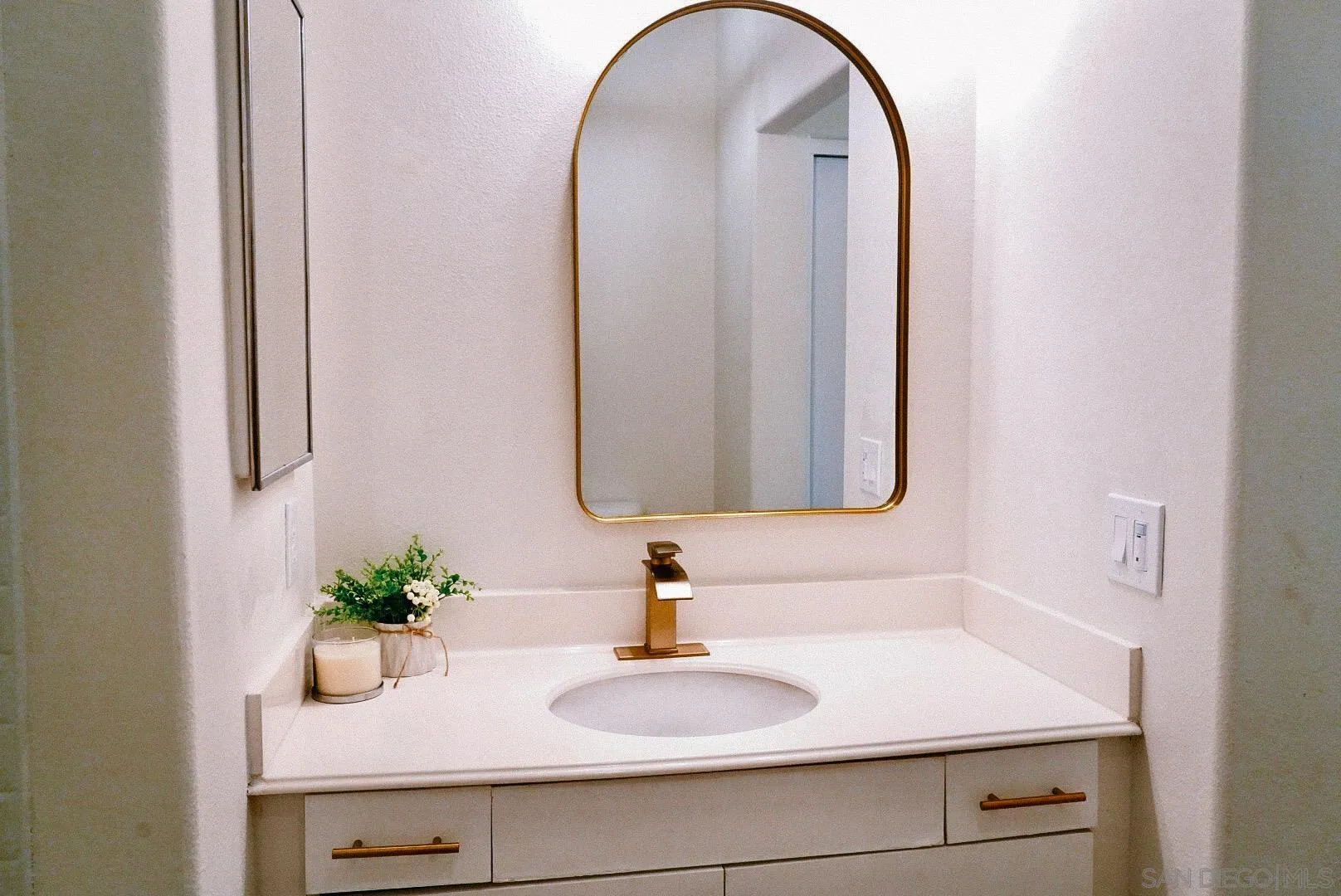 3537 Caminito El Rincon, Unit 259 San Diego, CA 92130 - Photo 50 of 59 a bathroom with a sink a mirror and a shower