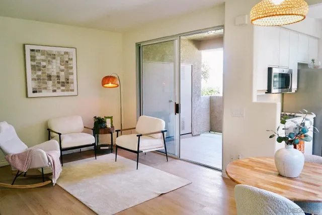 a bedroom with a bed and a wooden floor