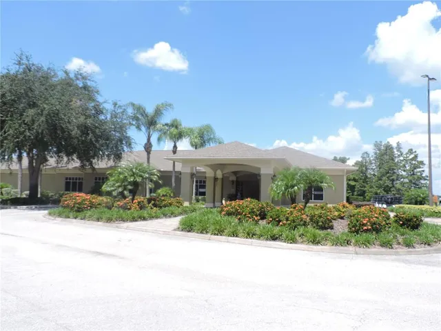 a house that has a tree in front of it