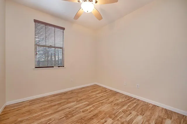 a living room with a couch and a window