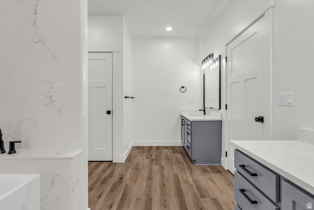 520 East 450th Street North Delta, UT 84624 - Photo 25 of 48 Bathroom with vanity, a soaking tub, light wood-type flooring, and recessed lighting