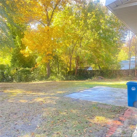 a view of a swimming pool and an outdoor space