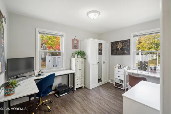 a workspace with furniture and a window