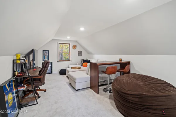 a bedroom with furniture and a wooden floor