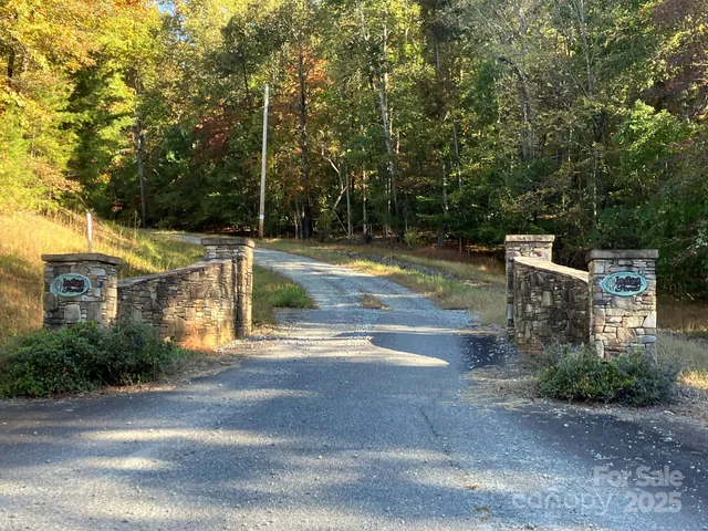 a view of a swimming pool with a yard