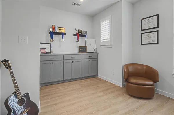 a room with a chair and a wooden floor