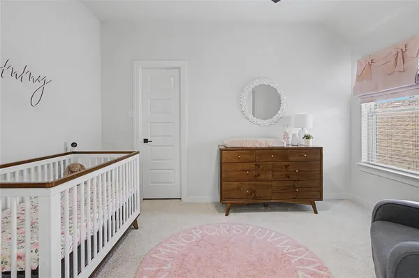 a bedroom with a bed and cabinets