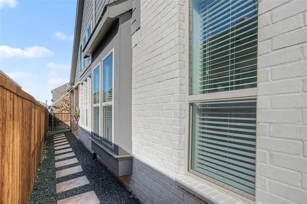 a view of a balcony with wooden door